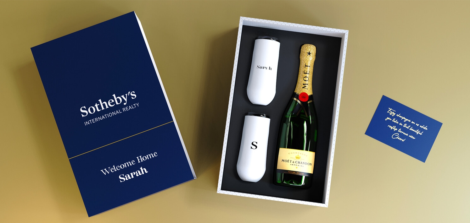 Custom gift box containing champagne and insulated flutes for a memorable gift. 3